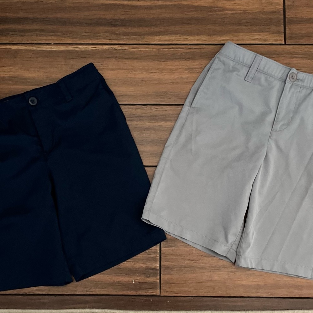 Bundle of underarmor shorts size 10. 1 navy and one gray.